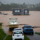A home is submerged in floodwaters caused by Hurricane Fiona in Cayey, Puerto Rico, on Sunday, September. 18, 2022. According to authorities three people were inside the home and were reported to have been rescued.